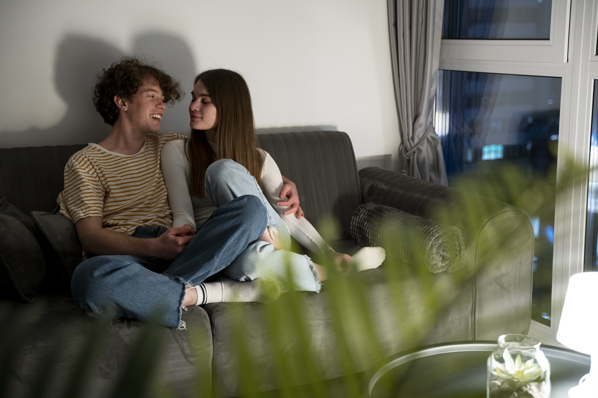 Couple at home sitting on the couch together