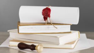 Certificate with wax seal on a pile of books front view